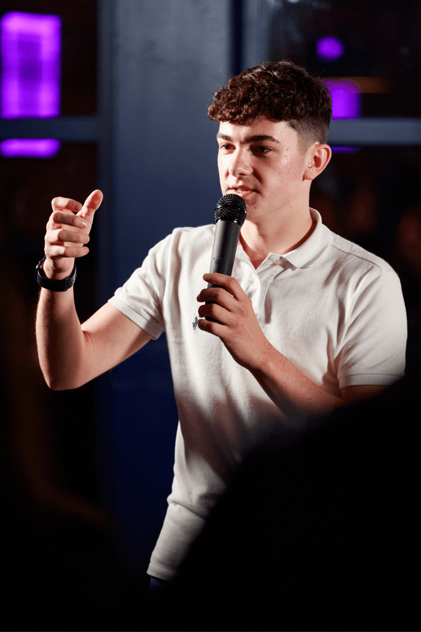 Ben speaking with microphone